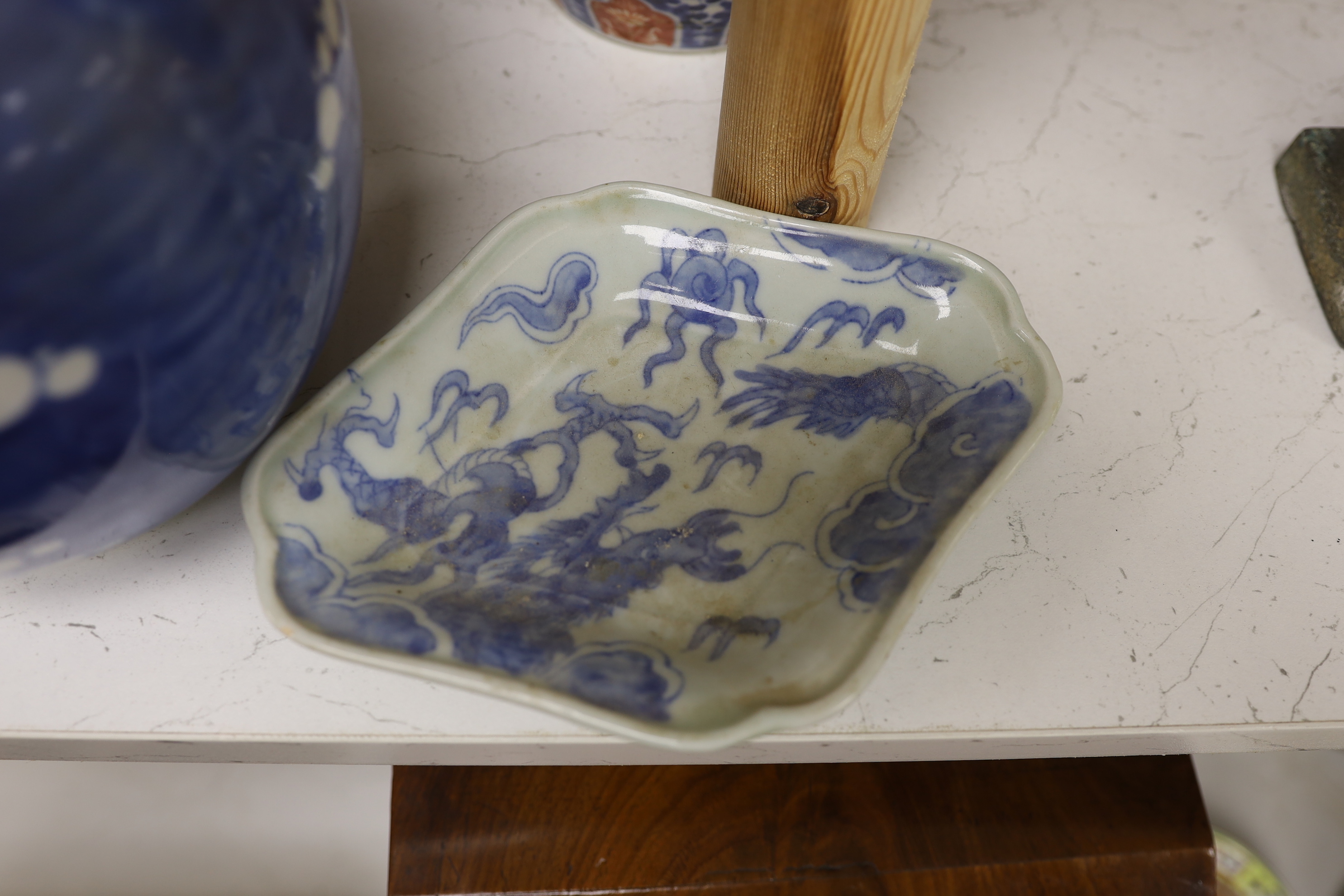 A Chinese blue and white lidded baluster vase, with damage, together with a lidded prunus ginger jar, a Japanese Kutani Export vase, a small blue and white dish (5), baluster vase and cover 27.5 cm high